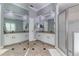 Bright bathroom with double vanity and glass enclosed shower on tile flooring at 8037 Bangle Ln, Orlando, FL 32836