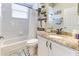 Bright bathroom features a shower-tub combo, granite countertops, and stylish decor at 8037 Bangle Ln, Orlando, FL 32836
