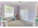Bright Bedroom filled with natural light, showcasing a charming color scheme, soft carpet, and ample space at 8037 Bangle Ln, Orlando, FL 32836