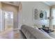 Cozy living space with an arched doorway that leads to the hall and bathroom, offering an inviting atmosphere at 8037 Bangle Ln, Orlando, FL 32836