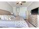 A beautifully staged main bedroom with an adjacent bathroom and walk-in closet at 8037 Bangle Ln, Orlando, FL 32836