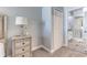 Well-lit main bedroom showing an ensuite bathroom with glass shower at 8037 Bangle Ln, Orlando, FL 32836