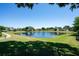 Picturesque view of community pond featuring a fountain and walking path at 8037 Bangle Ln, Orlando, FL 32836