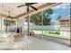 Charming screened lanai with views of the backyard, complete with a play area and lush landscaping at 8037 Bangle Ln, Orlando, FL 32836