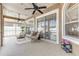 Relaxing screened lanai with comfortable seating and a view of the fenced backyard at 8037 Bangle Ln, Orlando, FL 32836