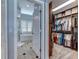 View of a main bathroom, and walk-in closet through a doorway at 8037 Bangle Ln, Orlando, FL 32836