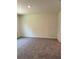 Cozy bedroom featuring neutral carpet and a blank canvas for personalization at 976 Commons Way, Port Orange, FL 32129