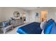 Inviting main bedroom featuring a view to other rooms and stylish gray furnishings at 976 Commons Way, Port Orange, FL 32129