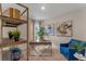 This home office boasts great artwork, natural light, and an accent chair at 976 Commons Way, Port Orange, FL 32129
