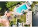 Aerial view of a pool and recreational area showing a lakeside community at 1000 Winderley Pl # 140, Maitland, FL 32751