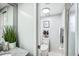 Clean bathroom with a toilet, shower, and a granite vanity at 1000 Winderley Pl # 140, Maitland, FL 32751