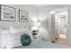 Bright bedroom features a relaxing color palette and leads to the en-suite bathroom at 1000 Winderley Pl # 140, Maitland, FL 32751