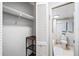 Spacious closet leads to the bright en-suite bathroom with a clean aesthetic and modern fixtures at 1000 Winderley Pl # 140, Maitland, FL 32751