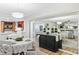 Charming dining room bathed in natural light, enhanced by a mirrored wall reflecting the living spaces at 1000 Winderley Pl # 140, Maitland, FL 32751