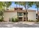Charming condo featuring a red tile roof, blue railing accents, and a well-maintained exterior with mature trees at 1000 Winderley Pl # 140, Maitland, FL 32751