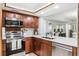 Updated kitchen featuring an oven and range hood at 1000 Winderley Pl # 140, Maitland, FL 32751