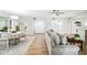 Inviting living space with wood floors, neutral colors, comfortable sofa, and dining area at 1000 Winderley Pl # 140, Maitland, FL 32751