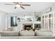 Comfortable living room with fireplace, neutral colors, and sliding glass doors for natural light at 1000 Winderley Pl # 140, Maitland, FL 32751