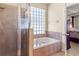Bathroom featuring a separate shower and soaking tub with tiled surround at 141 Campanello Ct, Daytona Beach, FL 32117