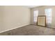 An empty room with beige carpet, offering endless possibilities for customization at 141 Campanello Ct, Daytona Beach, FL 32117