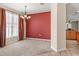 Inviting dining space with large windows and a stylish chandelier at 141 Campanello Ct, Daytona Beach, FL 32117