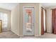 Inviting entryway features decorative glass door and tile flooring at 141 Campanello Ct, Daytona Beach, FL 32117