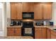 Well-equipped kitchen with granite countertops and modern appliances at 141 Campanello Ct, Daytona Beach, FL 32117