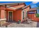 Covered front patio with outdoor seating, perfect for relaxing and entertaining at 141 Campanello Ct, Daytona Beach, FL 32117