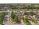 Aerial view showcasing the neighborhood, surrounding trees, and well maintained lawns at 5091 Plymouth Turtle Cir, St Cloud, FL 34772