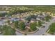 A neighborhood's aerial view with lush green trees and well-maintained properties at 5091 Plymouth Turtle Cir, St Cloud, FL 34772