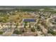 Wide aerial view of neighborhood homes near a large pond at 5091 Plymouth Turtle Cir, St Cloud, FL 34772
