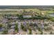 Aerial neighborhood view, lush landscape, and golf course nearby at 5091 Plymouth Turtle Cir, St Cloud, FL 34772