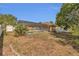 Backyard view featuring a screened-in pool and well-maintained lawn at 5091 Plymouth Turtle Cir, St Cloud, FL 34772