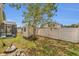 Backyard view with a screened-in pool, storage shed, and privacy fence at 5091 Plymouth Turtle Cir, St Cloud, FL 34772