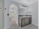 Bathroom featuring dual sink vanity with a modern mirror and access to the shower at 5091 Plymouth Turtle Cir, St Cloud, FL 34772