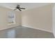 Bedroom featuring wood-look flooring and a ceiling fan at 5091 Plymouth Turtle Cir, St Cloud, FL 34772