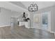 Open floor plan with a view from the dining area into a renovated kitchen and large living area at 5091 Plymouth Turtle Cir, St Cloud, FL 34772