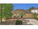 Inviting single-story home with lush landscaping, including palm trees and decorative rock borders at 5091 Plymouth Turtle Cir, St Cloud, FL 34772