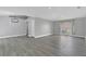 Spacious living area with neutral paint, modern lighting, and gray tile flooring for a contemporary feel at 5091 Plymouth Turtle Cir, St Cloud, FL 34772