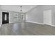Inviting living room with updated flooring, neutral walls, and ample natural light from the windows at 5091 Plymouth Turtle Cir, St Cloud, FL 34772