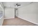 Neutral bedroom featuring ample lighting and modern ceiling fan at 1458 Heather Way, Kissimmee, FL 34744