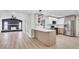 Modern kitchen with stainless steel appliances, white countertops, and wood-look cabinets at 1458 Heather Way, Kissimmee, FL 34744