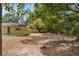 View of the home's backyard featuring abundant trees providing privacy and shade at 180 Broadmoor Rd, Lake Mary, FL 32746