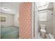 Bathroom view showcasing unique wallpaper and access to a modernly renovated shower at 180 Broadmoor Rd, Lake Mary, FL 32746