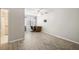 Bedroom boasts hardwood floors, a ceiling fan and desk area, adjacent to bathroom at 180 Broadmoor Rd, Lake Mary, FL 32746