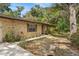 Classic brick house with well-kept yard featuring mature landscaping at 180 Broadmoor Rd, Lake Mary, FL 32746
