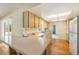 An open-concept kitchen featuring a breakfast bar and ample countertop space at 180 Broadmoor Rd, Lake Mary, FL 32746