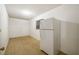 Kitchen area with white refrigerator, tile floors, window, and ample room for storage at 180 Broadmoor Rd, Lake Mary, FL 32746