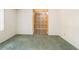 Bright living room with green carpet and an entryway featuring a vintage-style tiled floor at 180 Broadmoor Rd, Lake Mary, FL 32746