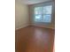 Bedroom with window and tile floors offering a bright living space at 200 Saint Andrews Blvd # 2306, Winter Park, FL 32792